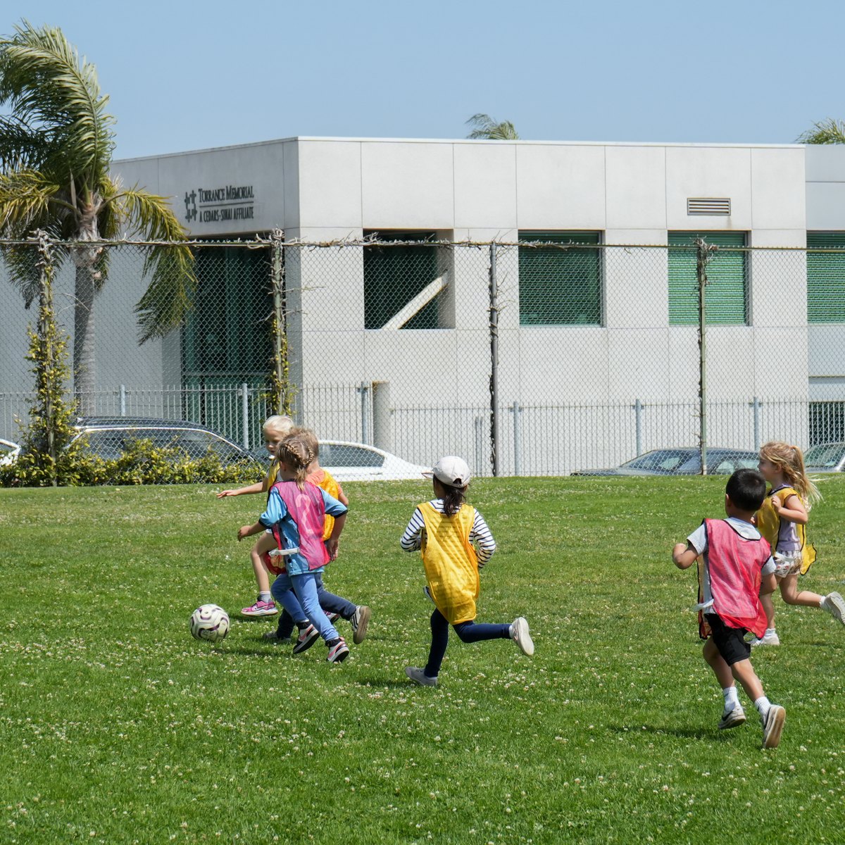 Preschool students playing soccer at after-school enrichment