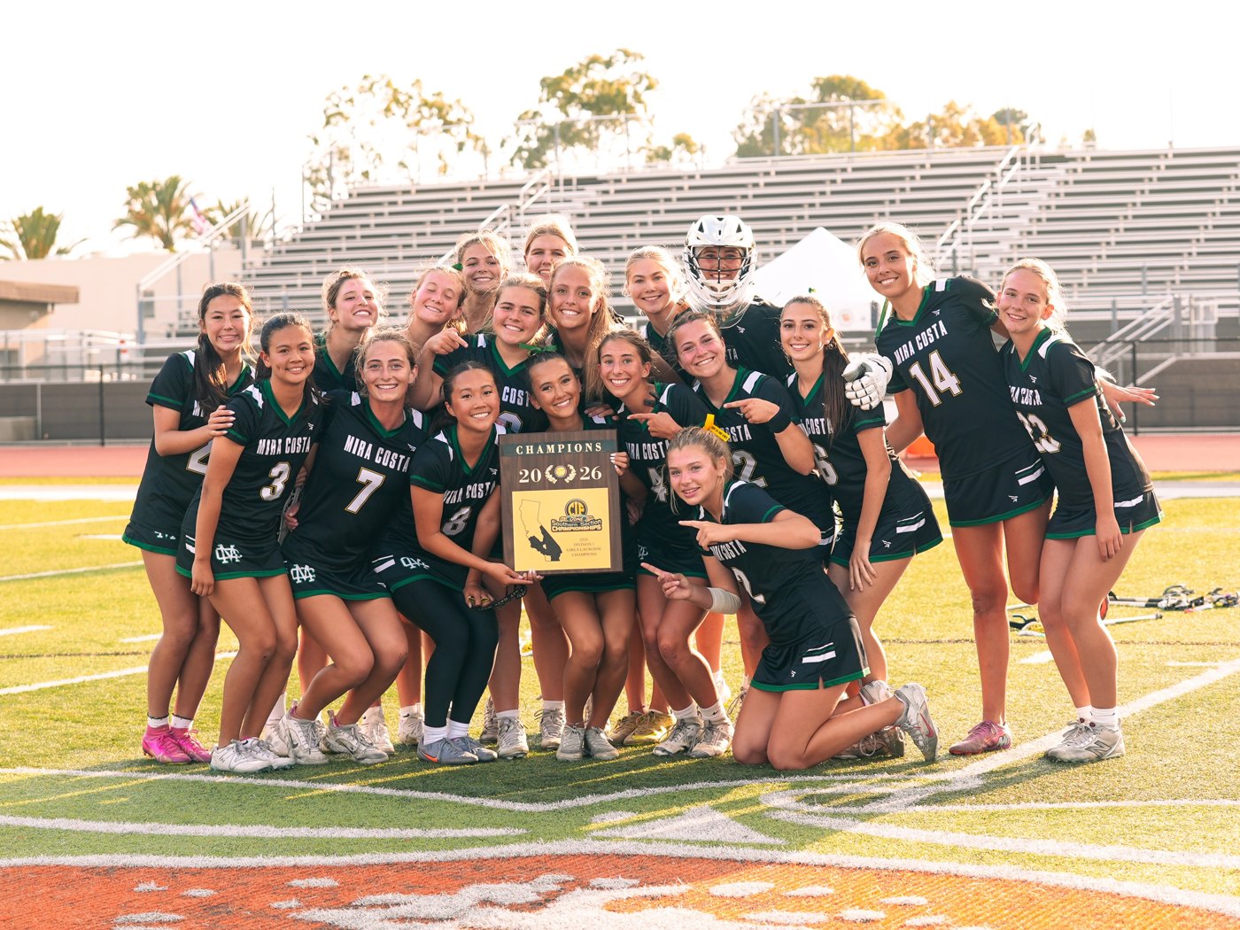 Mira Costa girls lacrosse team with the 2026 CIF Southern Section Division 1 championship plaque